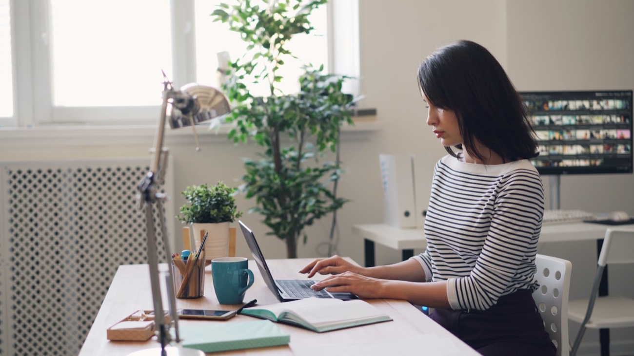 Accountant working at a bright desk in a Vilnius office
